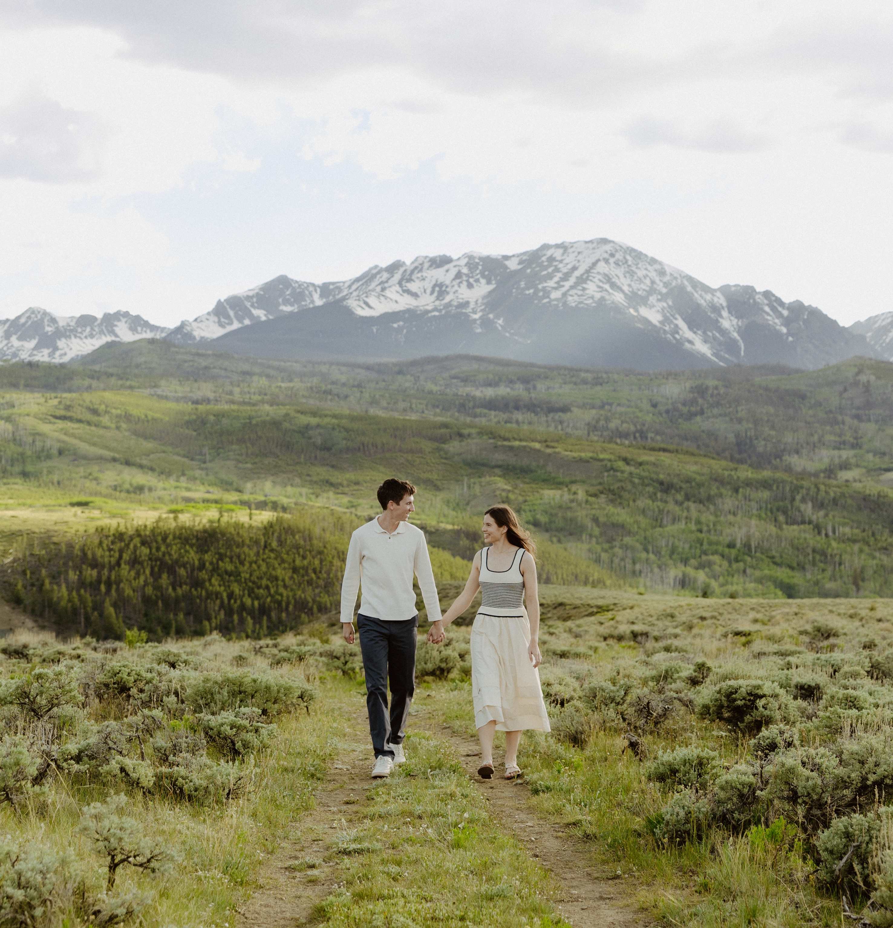 Lauren and Christian walking together in the mountains